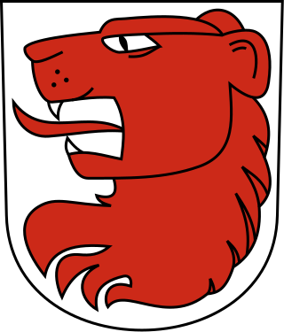 Das Wappen von Wäldi: ein roter Löwenkopf auf weissem Hintergrund