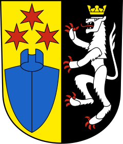 Das Wappen von Wigoltingen: ein weisser Löwe auf schwarzem Hintergrund