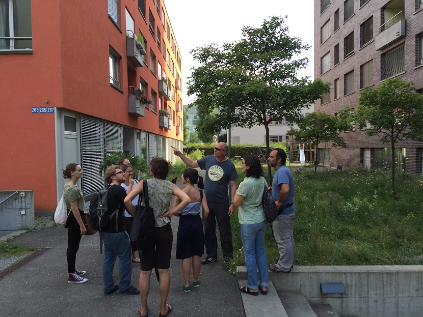 Tour through Kraftwerk1 Housing Cooperative Zurich, Switzerland with international guests.